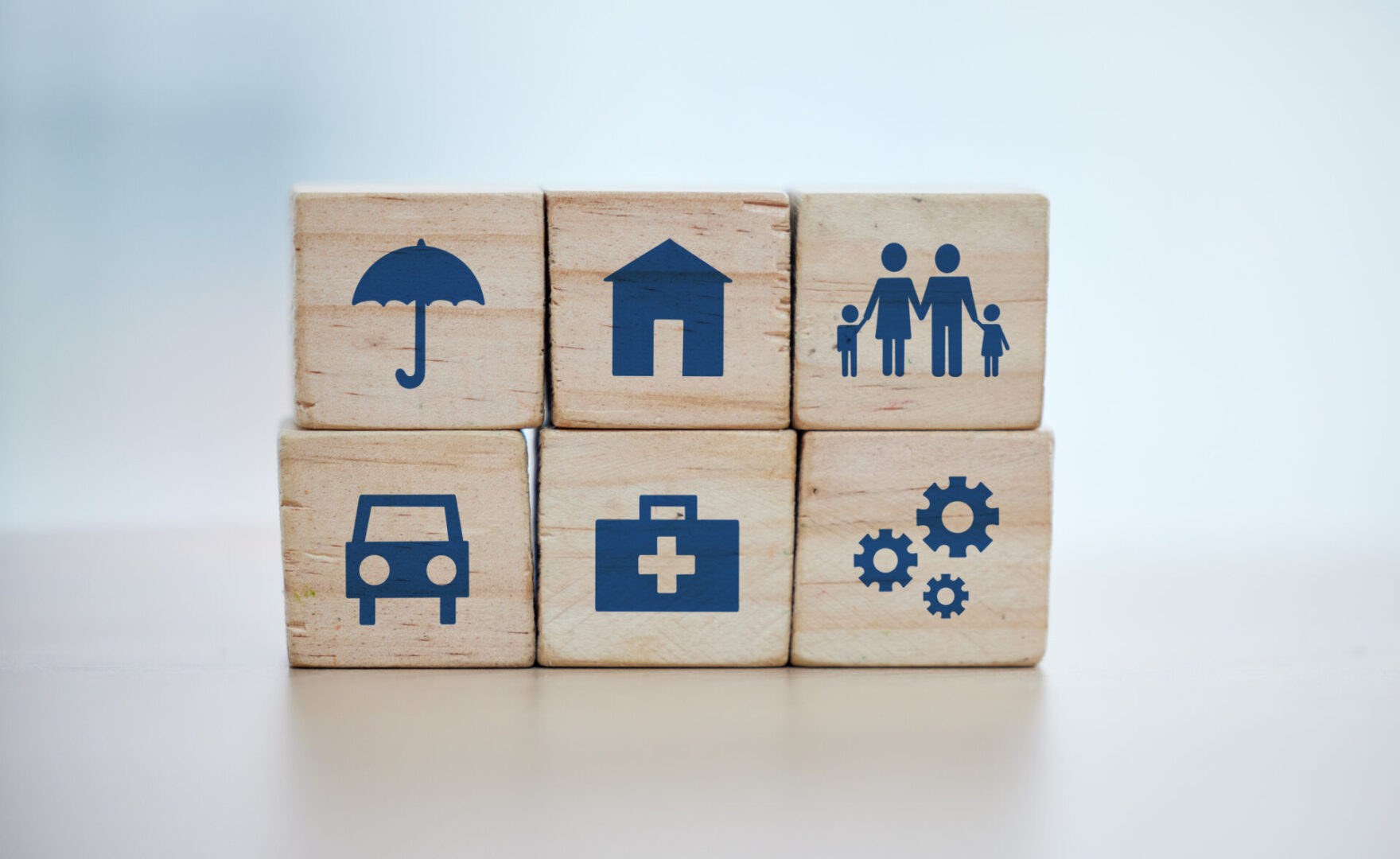 Wooden, cubes or stack in house risk management, security or future protect on background desk mockup or home table. Zoom, building blocks or life insurance in medical, car loan or mock up cog wheel